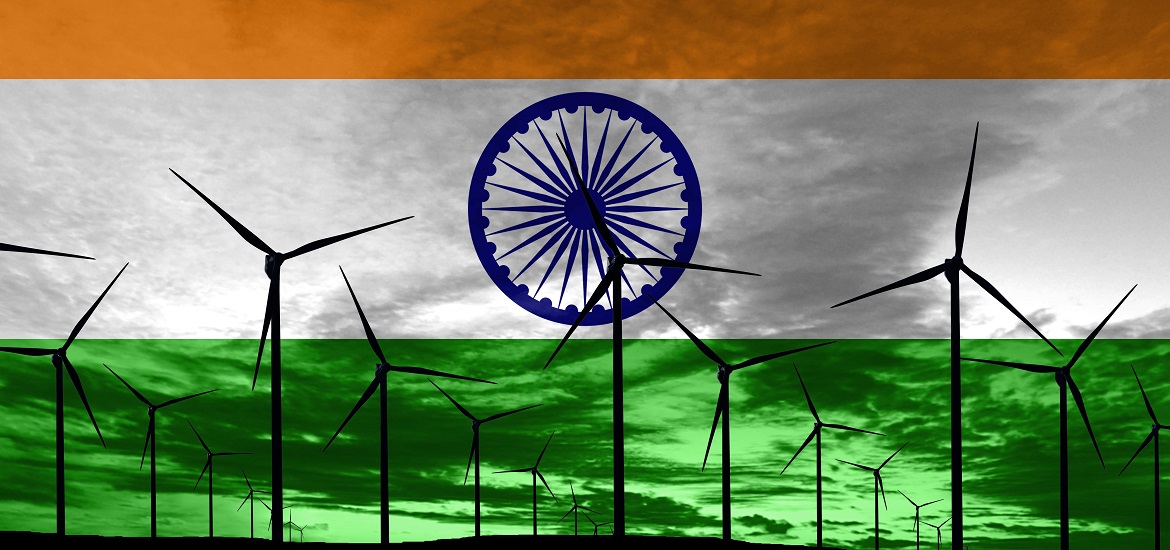A field of wind turbines on a background representing the Indian flag.